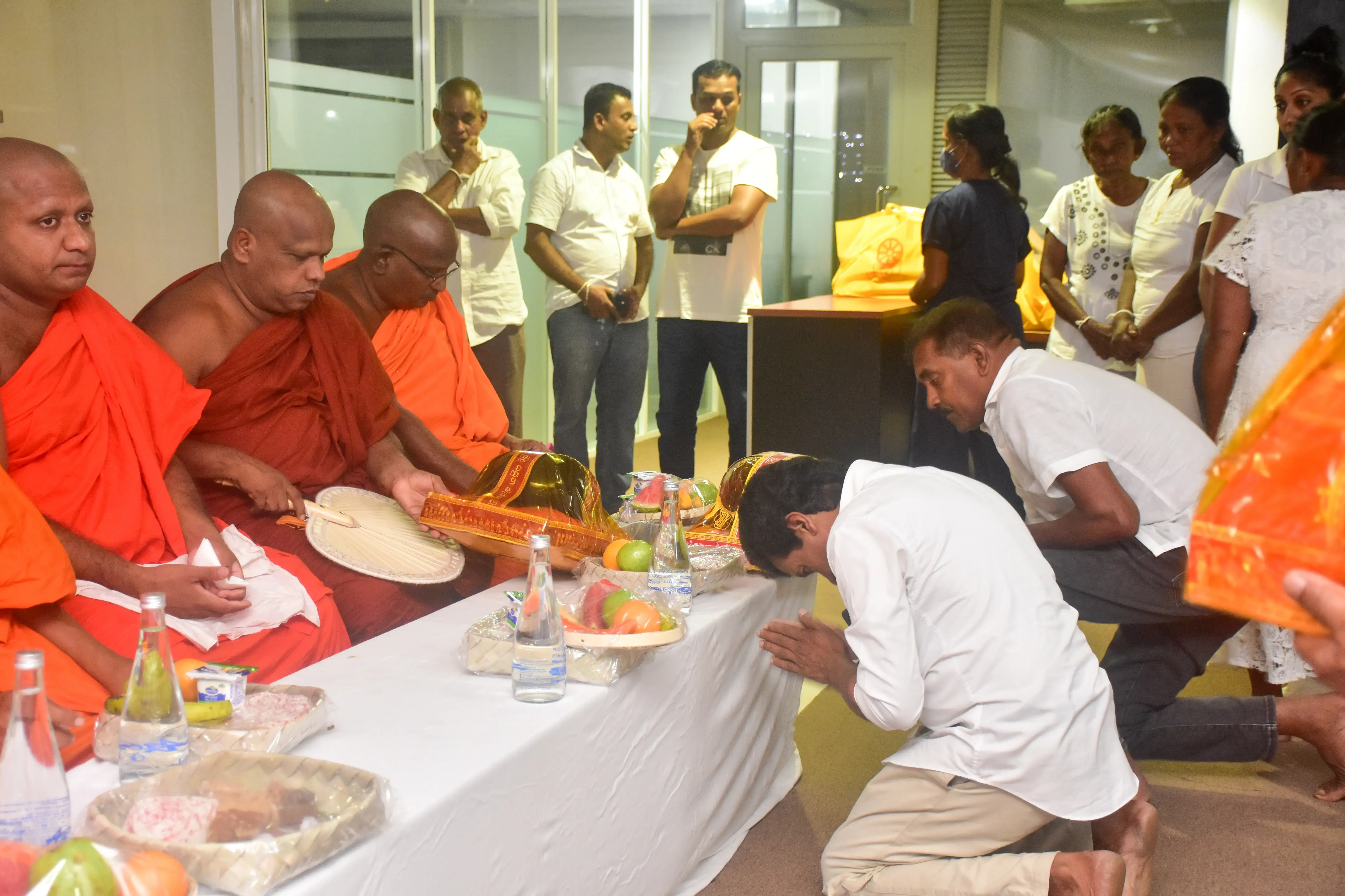 Hirdaramani employees offering gifts for monks and worshiping