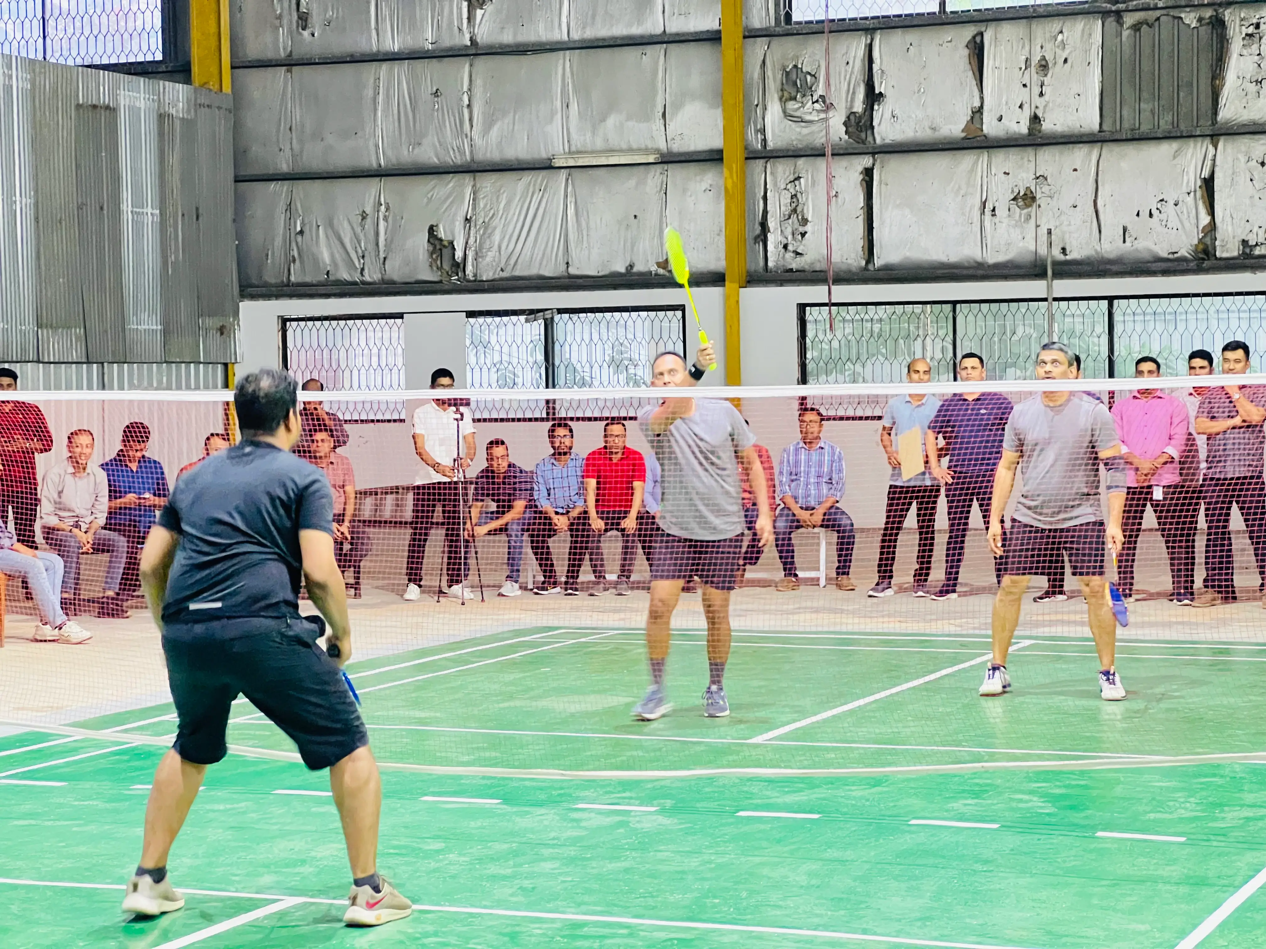 Two male badminton groups in a match of interdepartmental badminton championship of hirdaramani