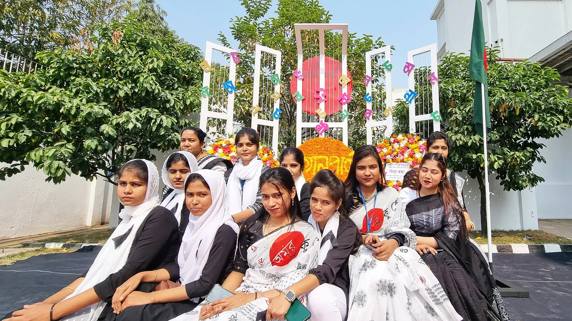 Few Female employees of Hiradaramani of Bangladesh factory in a group photo wearing sarees