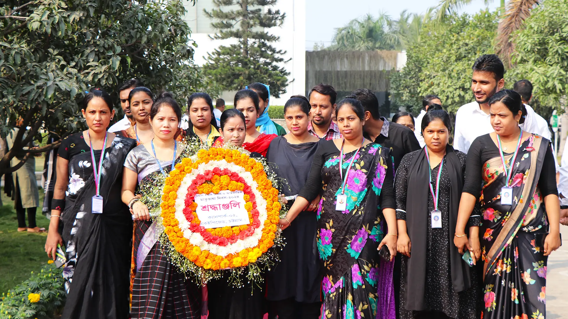 Few Bangladesh employees of Hirdaramani carrying a flower bouquet for an event participation