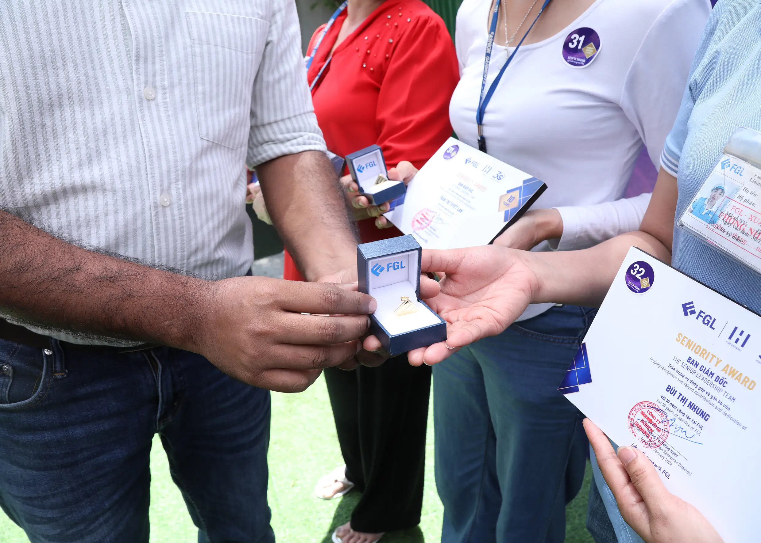 Employees holding gifts and certificates of seniority awards