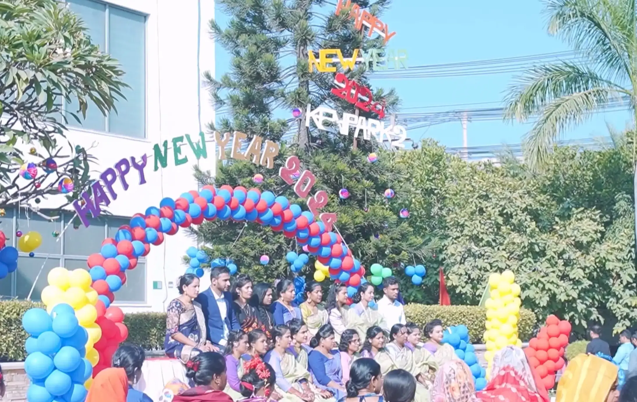 Employees participating for a group photo for the new year 2024 event