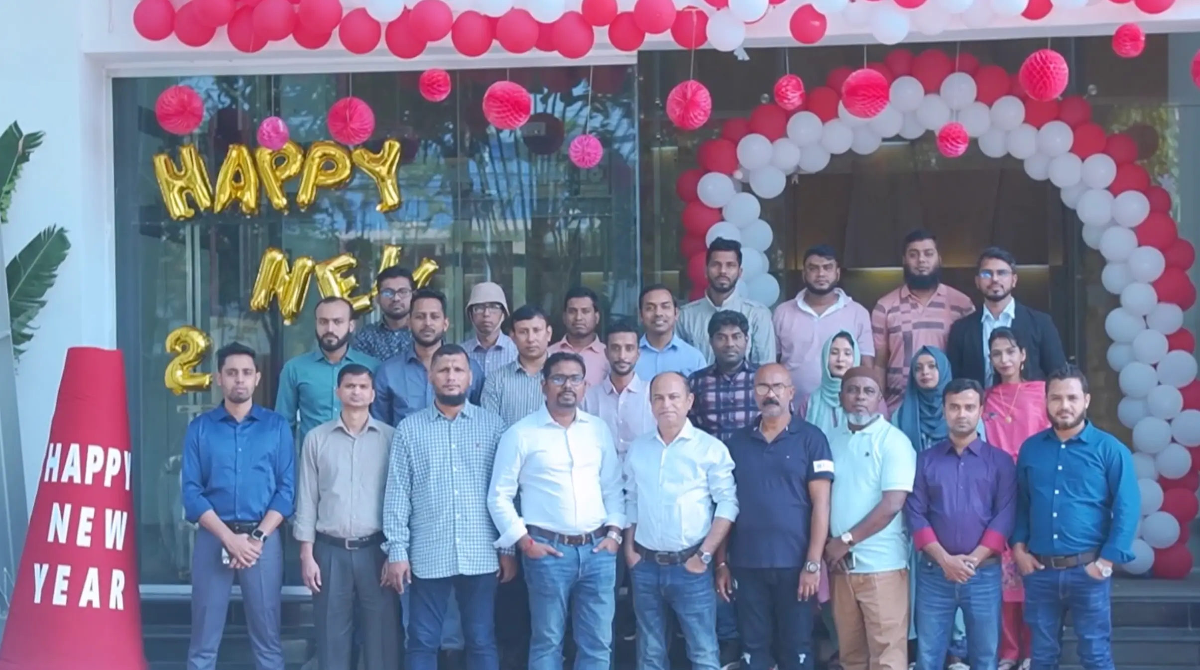 Male Employees participating for a group photo for the new year 2024 event